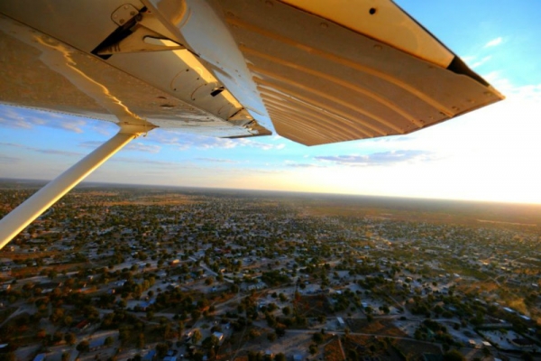 Wing of plane over Okavango Delta