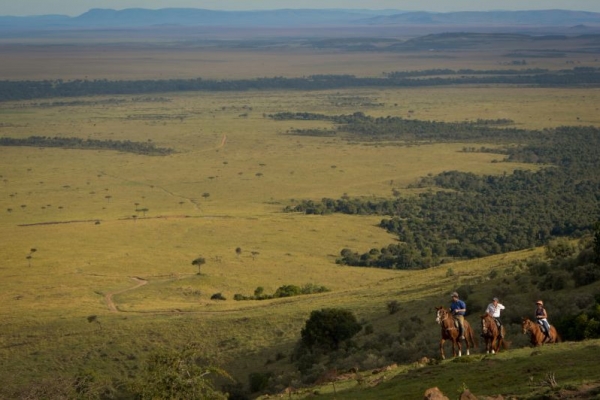 Horse riding on the ridge of a hill in Kenya