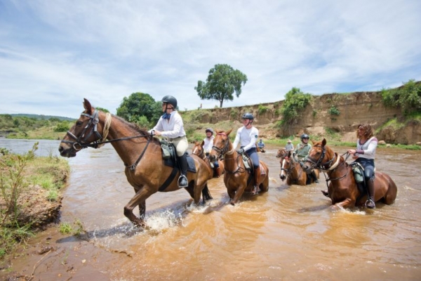 river crossing on horseback in the Masai Mara