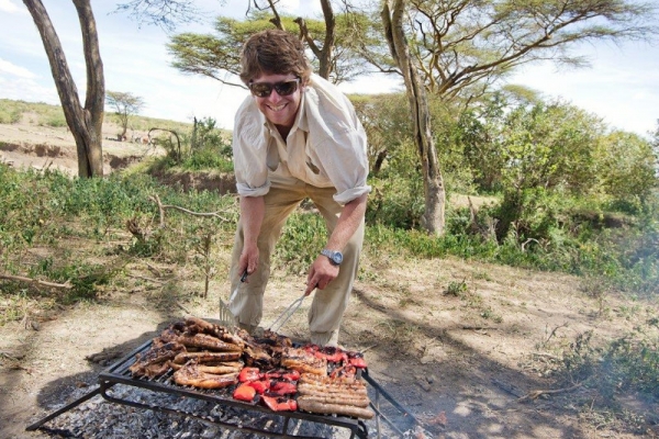 smiling man braaiing in Kenya