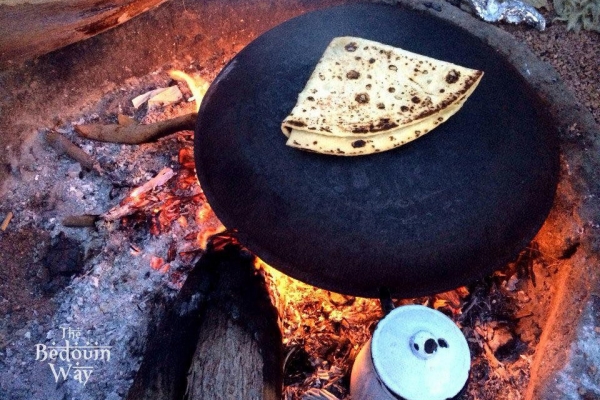Traditional Arabic Bread cooking on fire