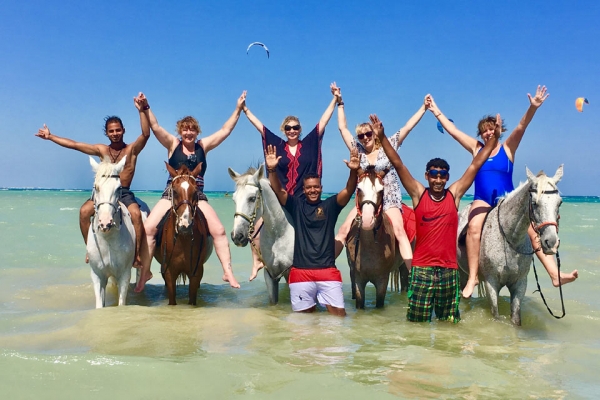 happy people on horseback in the Red Sea
