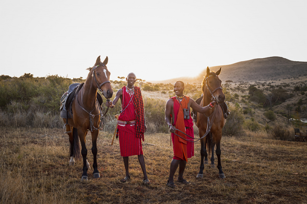 Two Maasai safari guides with their horses