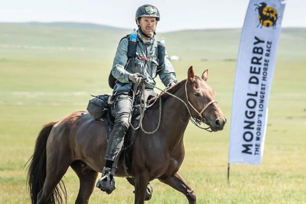 Man on horse competing Mongol Derby