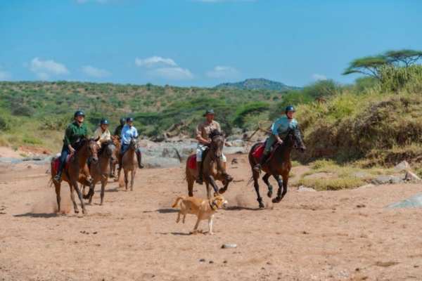 Cantering on horseback at Rocky Hollow in Kenya