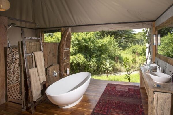 Bath overlooking the Mara River in the Masai Mara at House in the Wild, Kenya